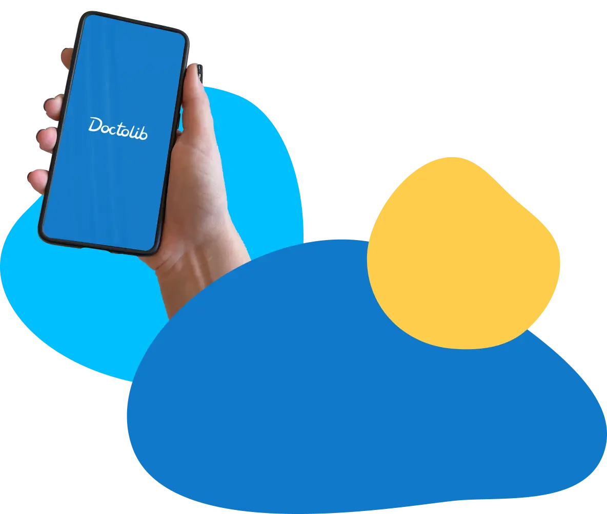 Hand holding phone with Doctolib app